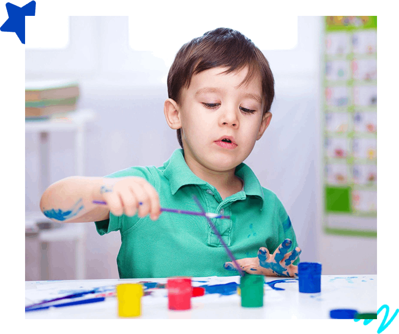 A boy playing with the colors