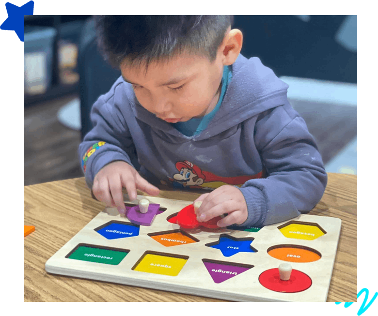 A boy playing with the school toy